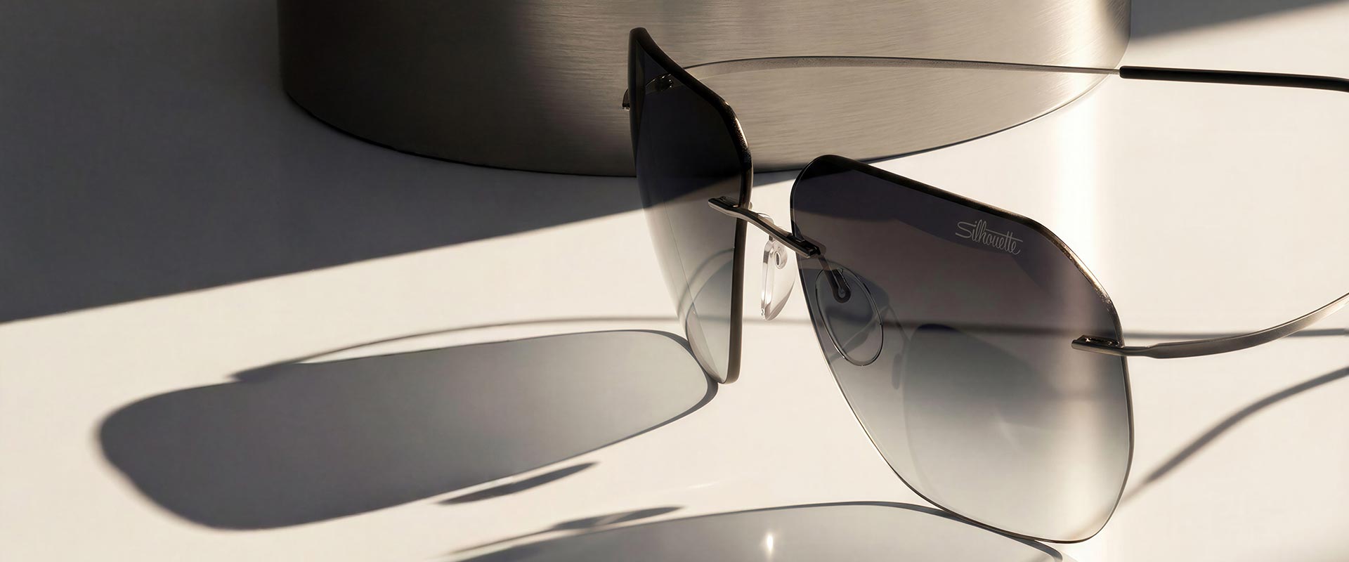 Close-up of Silhouette Titan Minimal Art rimless glasses, with the Silhouette name etched into the lens