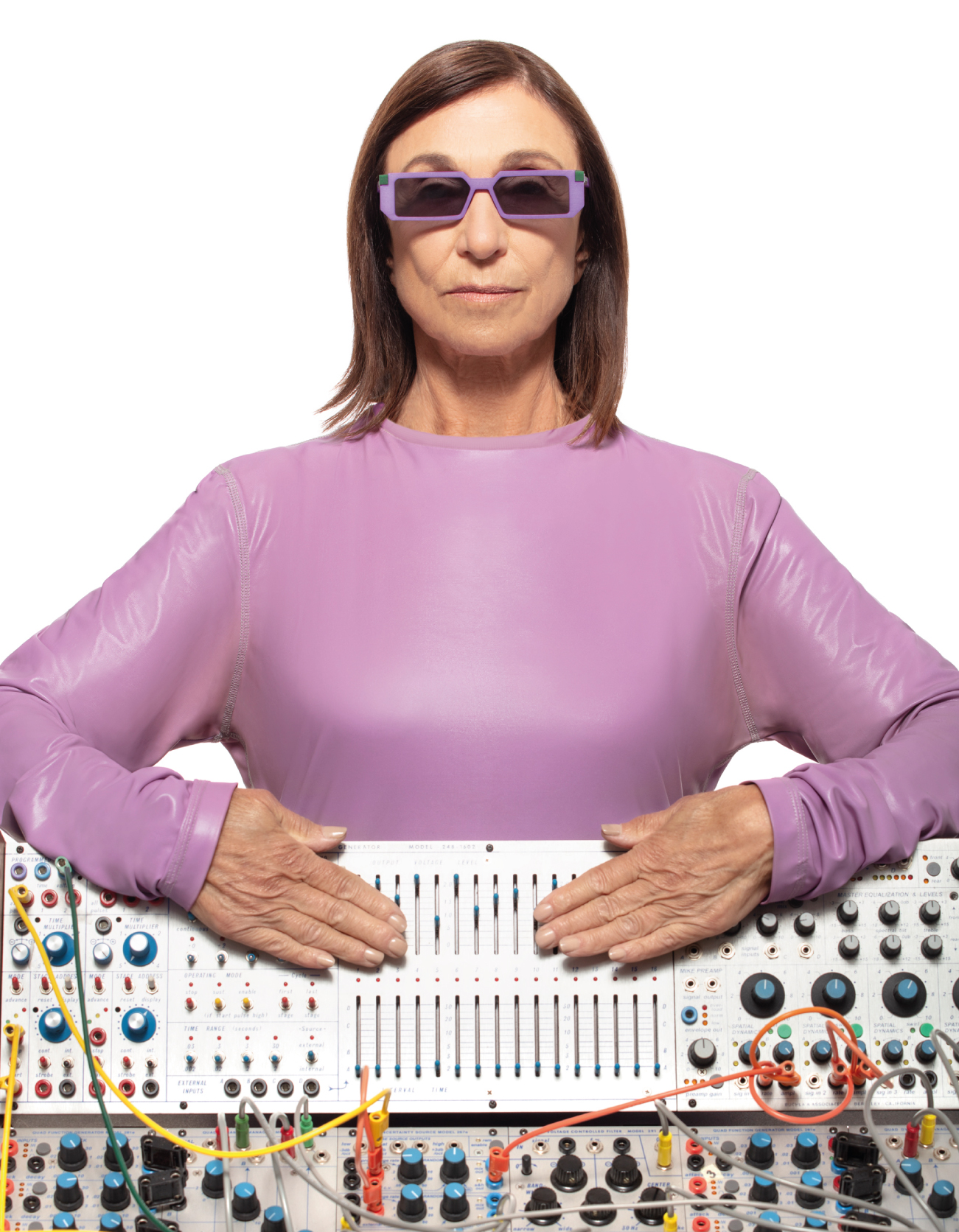 Suzanne Ciani at her modular synthesizer, wearing purple rectangular VAVA glasses